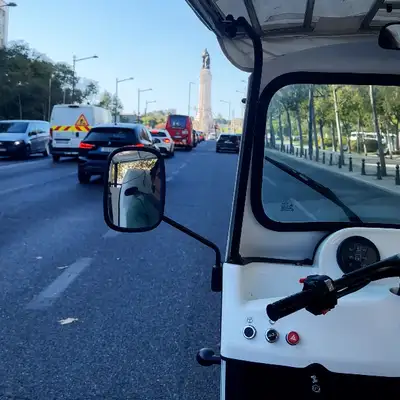 View from the tuk-tuk driving up Avenida da Liberdade towards the Marquês de Pombal monument